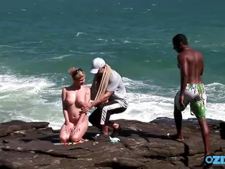 Busty Blonde Invites Strangers To Stuff Her Hard By The Sea